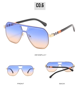 Detail view of retro oversized metal sunglasses with gradient lenses and striped temples