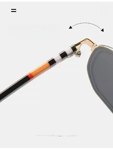 Detail of durable metal hinge and geometric acetate pattern on retro square sunglasses