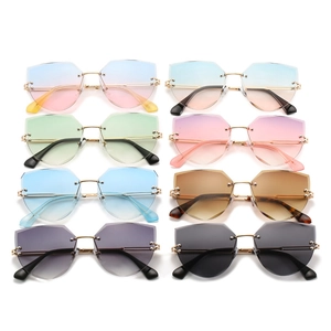 Collection of rimless geometric cat eye sunglasses in multiple gradient lens colors