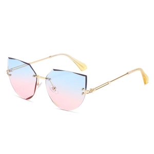 Frameless geometric cat-eye sunglasses with blue-pink gradient lenses and gold metal temples