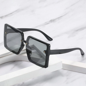 Classic black oversized square frame sunglasses with golden rivets and smoky lenses