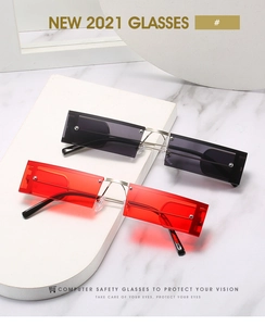 Close-up of rectangular rimless sunglasses with red and black tinted blue light lenses