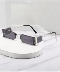Detailed macro view of rectangular sunglasses featuring silver metal frames and side shields