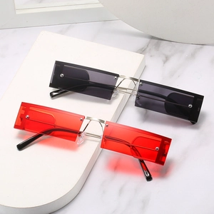 Retro square punk sunglasses with red and black lenses on a metallic silver frame