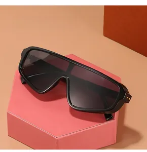 Close-up of black oversized shield sunglasses on a modern display stand with special design