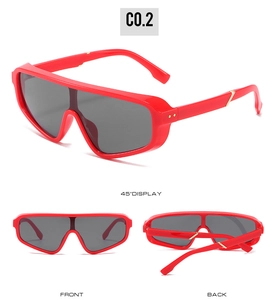 Three-angle views of red one-piece sunglasses with gold V-detail and grey lenses