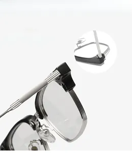 Detail view of reinforced metal hinge and mortise temples on square glasses frames
