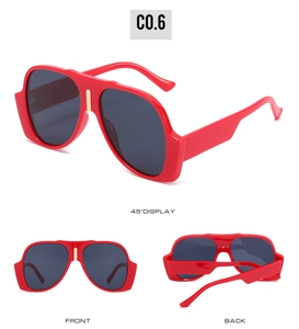 Three-way view of red oversized sunglasses with thick temples and gold metal U-shaped accent