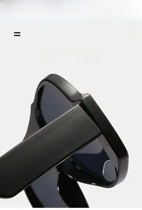 Detail of high-gloss wide temple hinges on black oversized fashion sunglasses