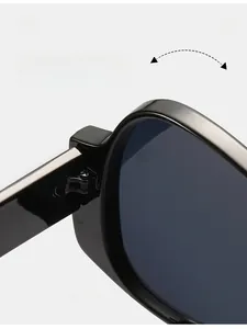 Macro view of durable metal hinge on black oversized sunglasses with thick temples