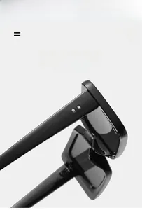 Detail of square black sunglasses showing durable metal hinges and lightweight frame
