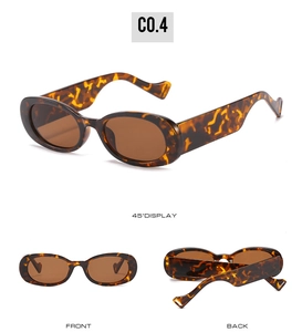 Détail de lunettes de soleil ovales en écaille avec branches ondulées et verres bruns