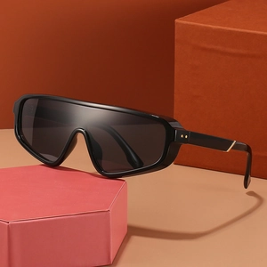 Modern oversized shield sunglasses in glossy black with golden metal decorative studs