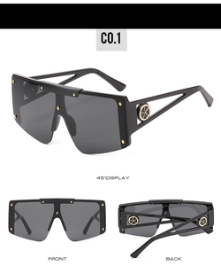 Macro detail of flat top sunglasses with gold rivets and hollow geometric temples