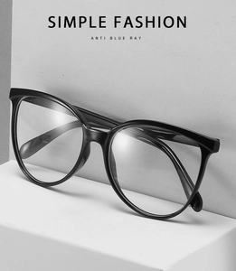 Detail of black cat-eye anti-blue light glasses with decorative rivets on sleek frame