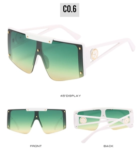 Detailed views of white oversized sunglasses with green yellow gradient lenses and gold rivets