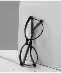 Detail shot of black retro square frame glasses with anti-blue light clear lenses