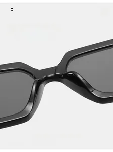 Close-up of comfortable integrated nose pads on glossy black square sunglasses frame