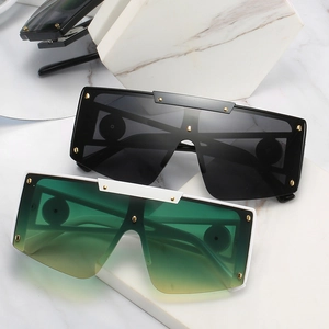 Oversized shield sunglasses with metallic studs on elegant marble blocks