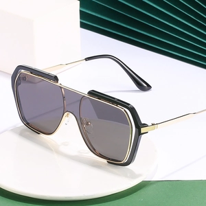 Oversized retro square sunglasses with gold metal temples and flat top black frame