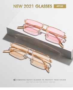 Detail of square gold metal frame glasses with pink and yellow transparent lenses