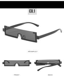 Detail view of pixel-style rectangular sunglasses with unique jagged geometric edges