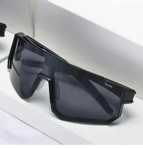 Detail view of black cycling sunglasses with oversized lenses and industrial design