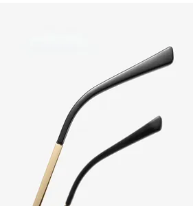 Close-up of golden metal temples with black plastic tips for anti-blue light glasses
