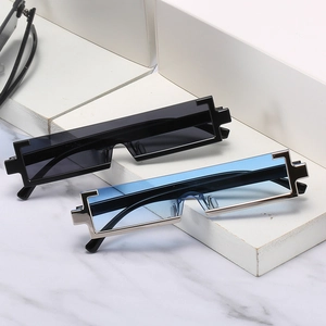 Futuristic pixel-style square sunglasses with narrow geometric frames on a marble display