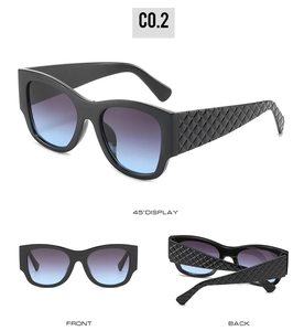 Detail view of square black sunglasses with blue-purple gradient lenses and quilted arms