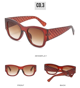 Detail view of tortoiseshell sunglasses with quilted temples and gradient lenses