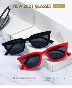 Detail view of retro cat eye blue light blocking glasses in black and red frames