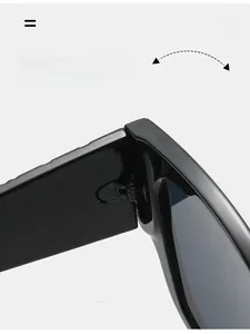 Macro detail of the durable metal hinge assembly on black square frame sunglasses