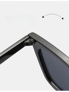 Detail of durable reinforced metal hinge and screw design on retro cat eye sunglasses
