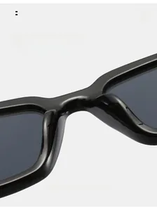 Detailed macro view of the integrated thickened nose pads on black cat-eye sunglasses
