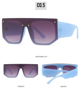 Detail view of flat top sunglasses with blue frames and purple gradient lenses
