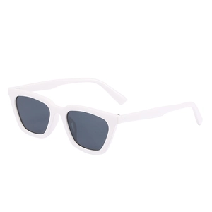 Retro cat-eye sunglasses with cream white frame and dark grey lenses in 45-degree view