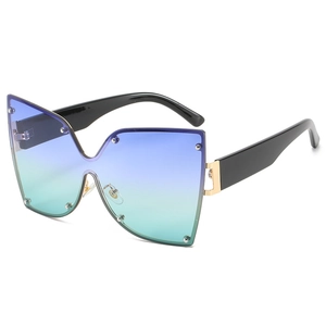 Lunettes de soleil papillon surdimensionnées avec verres dégradés bleu-vert et rivets en métal