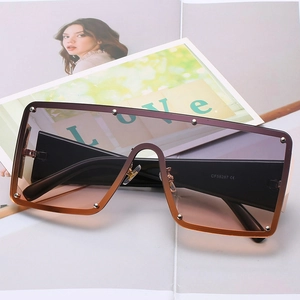 Lunettes de soleil carrées surdimensionnées sans monture avec verres dégradés et rivets