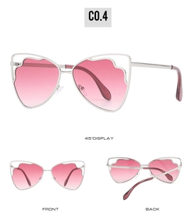 Detailed view of cat-eye butterfly wing sunglasses with pink gradient lenses and silver frame