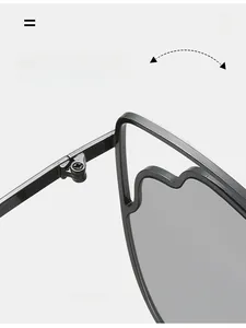 Detailed close-up of a durable metal hinge on stylish flame-edged cat eye sunglasses