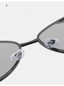 Detail of comfortable clear silicone nose pads on black cat-eye sunglasses frame