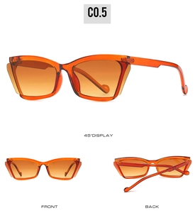 Detail view of transparent orange cat eye sunglasses with thick temples and side shields
