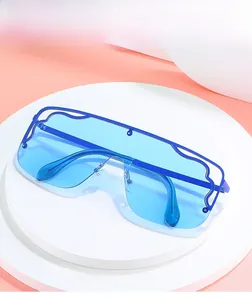 Close-up of blue flat top oversized sunglasses with wave metal hollow decorative frame