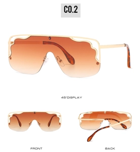 Detailed views of oversized flat top sunglasses with gold wavy frame and orange lenses