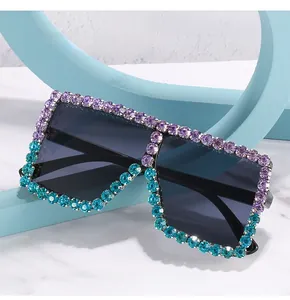 Detail of square sunglasses with dual-tone purple and blue rhinestones on the frame