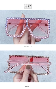 Detail of square oversized rhinestone sunglasses with pink gradient lenses and gems