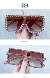 Detail view of square rhinestone sunglasses with brown gradient lenses and dual-tone crystal frame