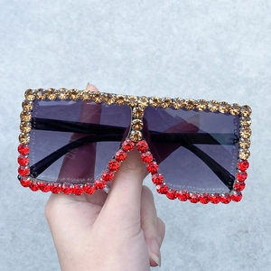 Rectangle sunglasses with amber and red rhinestones on a stylish large frame for women
