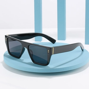 Modern flat top square sunglasses with black frames and decorative gold metal rivets